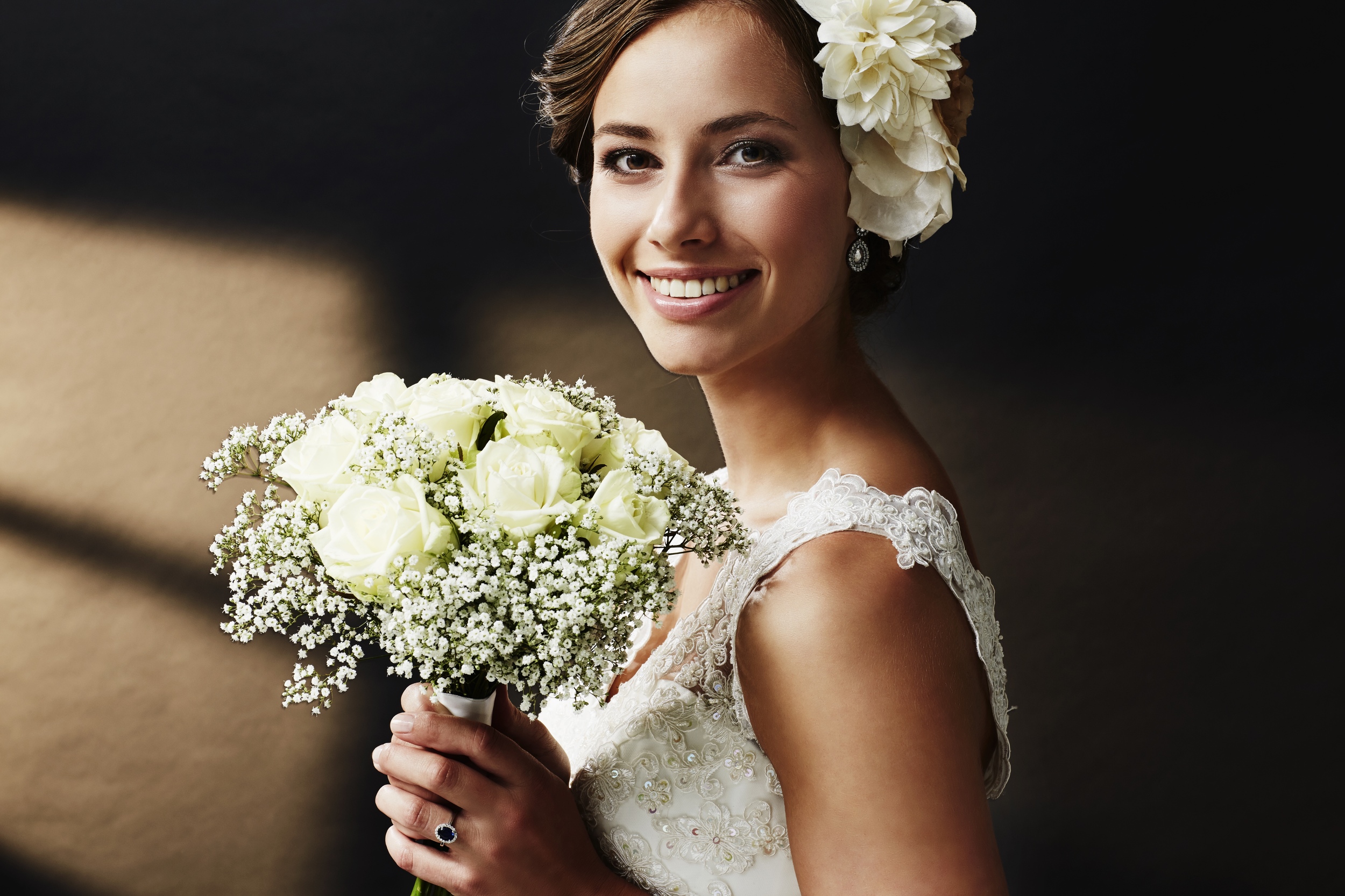Stunning young bride holding bouquet, portrait